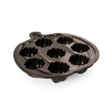 Nordic Ware aluminum Lil' Pumpkin Cakelets pan with 6 pumpkin-shaped cavities, angled view showing interior detail