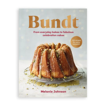 Nordic Ware Bundt cookbook with white cover featuring colorful bundt cakes and celebration theme