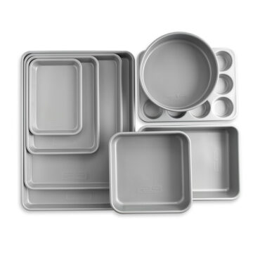 Nordic Ware 8-piece nonstick baking pan set with various rectangular and round pans in charcoal gray finish