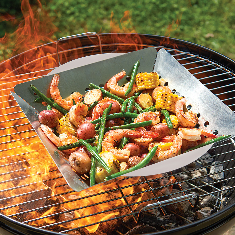 Image of Nordic Ware Grill Basket on the grill with veggies in it