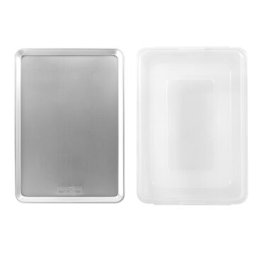 Nordic Ware aluminum big sheet pan with fitted lid, both pieces shown separately on white background
