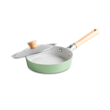 Nordic Ware Cardamom 8-inch nonstick saute pan with glass lid, cream colored exterior, angled view