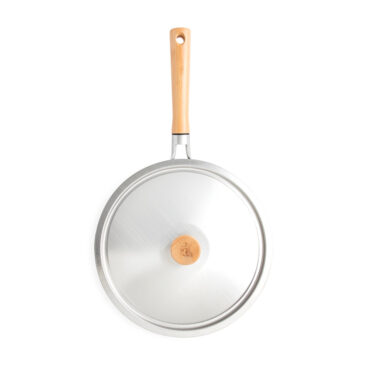 Nordic Ware Cardamom 10-inch nonstick frying pan with glass lid, cream exterior finish on white background