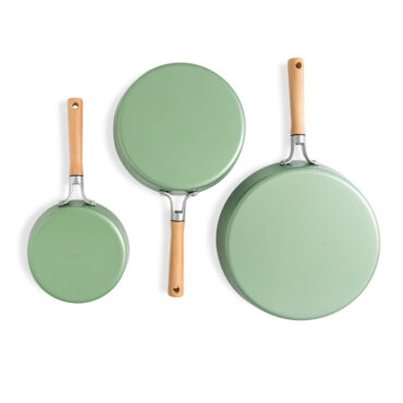 Three Nordic Ware Cardamom nonstick frying pans with lids in cream color, showing exterior view on white background