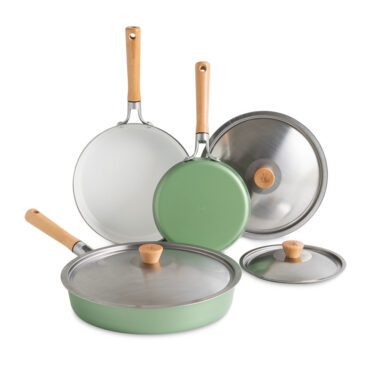 Nordic Ware Cardamom 6-piece nonstick frying pan set with lids, cream-colored cookware on white background
