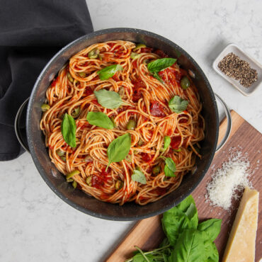 8qt Stock Pot with Lid on stovetop with spaghetti; overhead