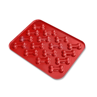 Nordic Ware red aluminum baking pan with six puppy-shaped cavities for making dog treat molds