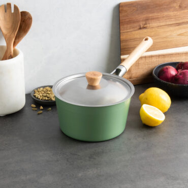 Nordic Ware 3-quart stainless steel saucepan with matching 8-inch cardamom lid on kitchen counter with spices