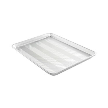 Nordic Ware aluminum half sheet pan with matching lid, natural silver finish, angled view showing rectangular shape