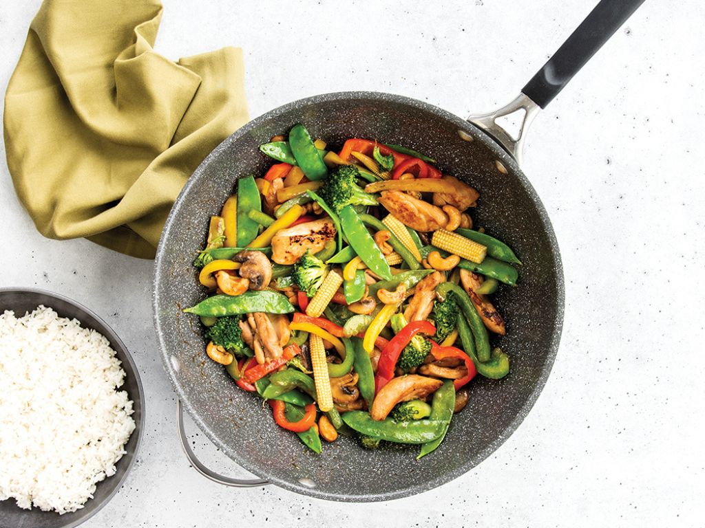 Stir Fry cooked in the Nordic Ware Verde Ceramic Nonstick 12” Wok served with some rice.
