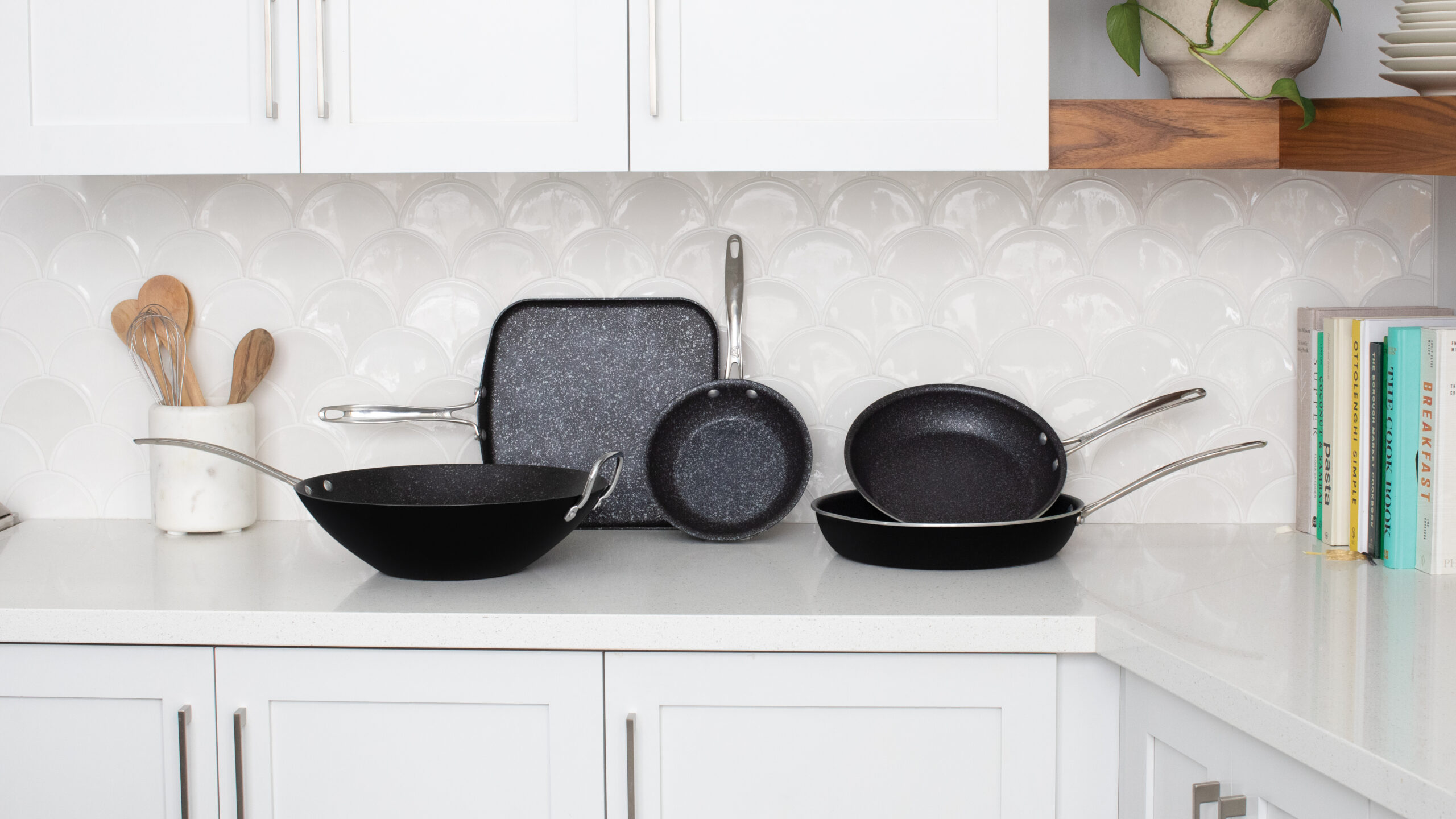 Collection image of Nordic Ware Basalt Nonstick Ceramic Cookware Collection on the counter top of a white kitchen.