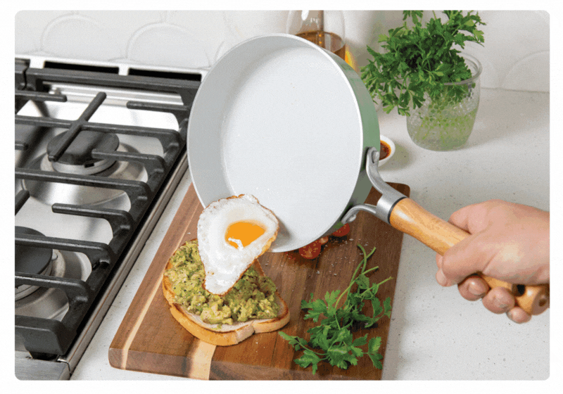 Gif of cooking an egg in a Cardamom Nonstick Ceramic Skillet then easily cleaning the pan in the sink using water and a soft sponge.