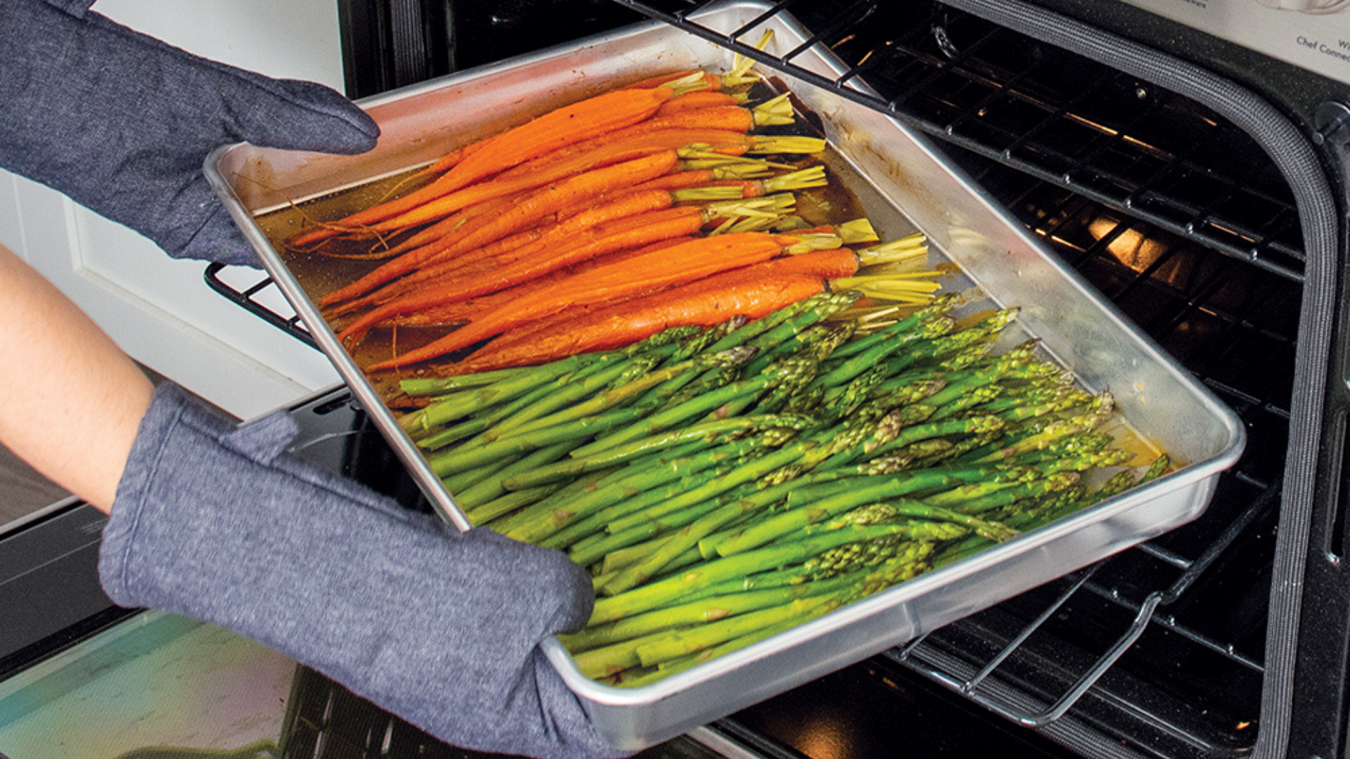 Roasted Vegetables in Naturals® High Sided Sheetcake Pan Roasted carrots and asparagus in a Naturals® High Sided Sheetcake Pan.