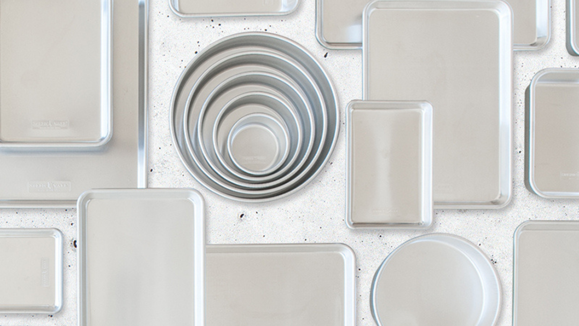 Nordic Ware’s Naturals® Aluminum Bakeware collection flat lay Nordic Ware’s Naturals® Aluminum Bakeware collection on countertop.