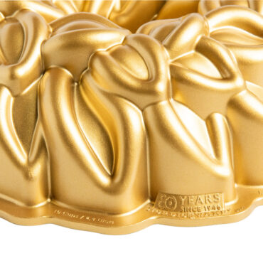 Laurel Wreath Bundt Pan with gold exterior closeup