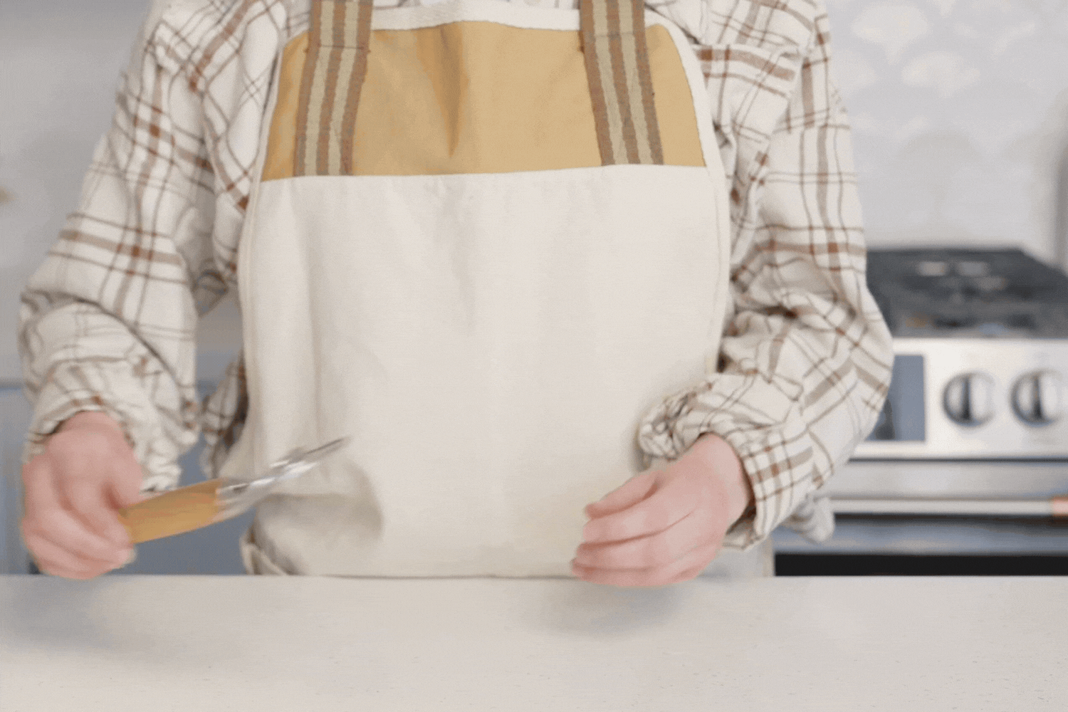 Gif of a baker mixing sourdough dough with the Danish Dough Whisk from the Simply Sourdough Bread Baking Kit. 