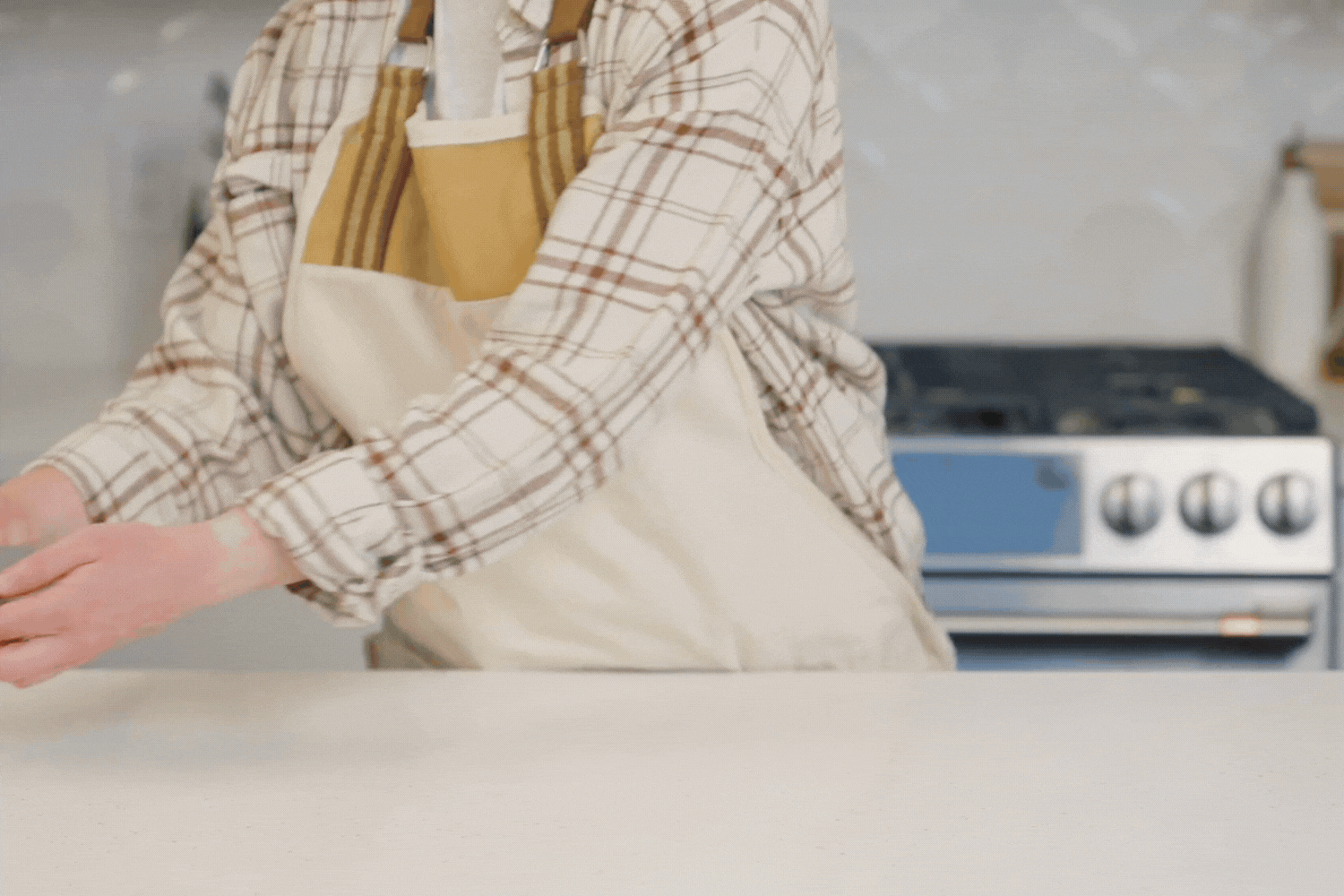 Showing off the Escali Digital Baking Scale with hands then placing a glass bowl on top of it.