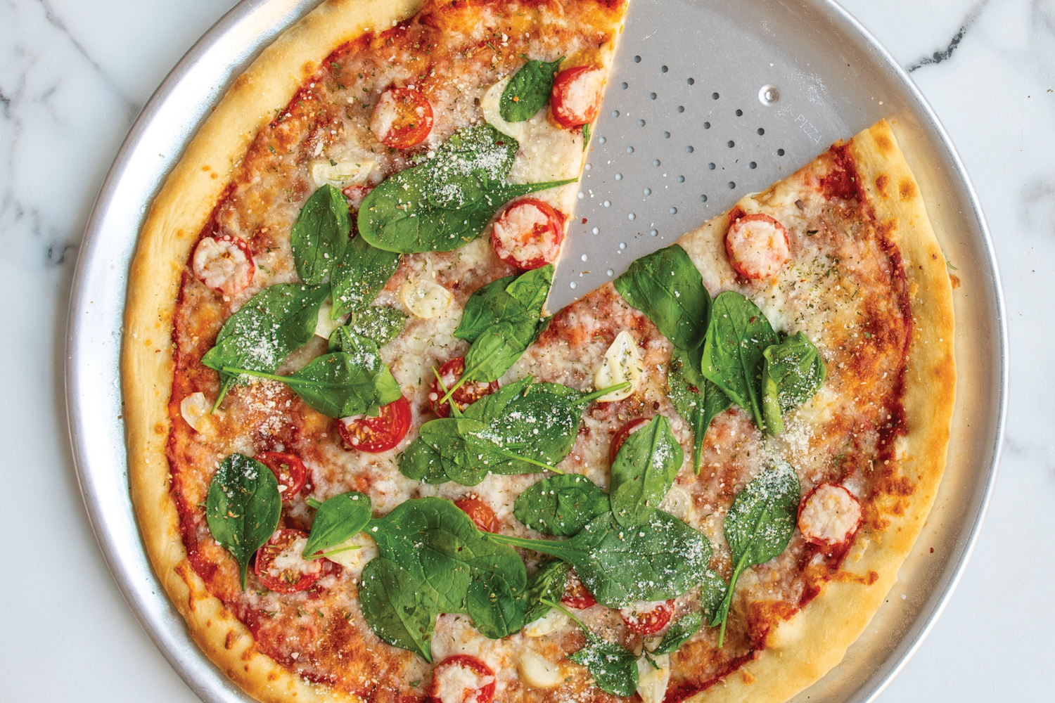Naturals® 16" Hot Air Pizza Crisper with margherita pizza on it.