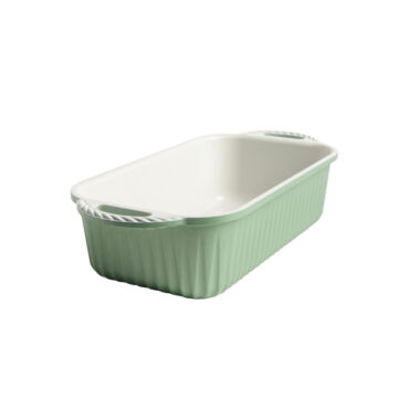 cardamom loaf pan with on white background with green exterior and white nonstick interior