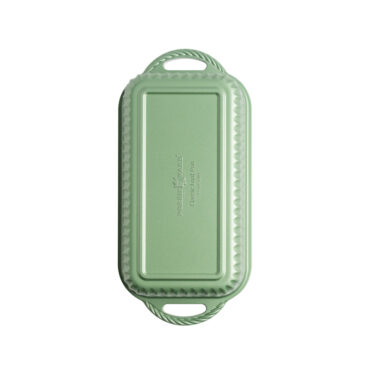 overhead view of cardamom loaf pan on white background showing green exterior