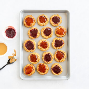 overhead image of brilliant half sheet with pb&j cookies