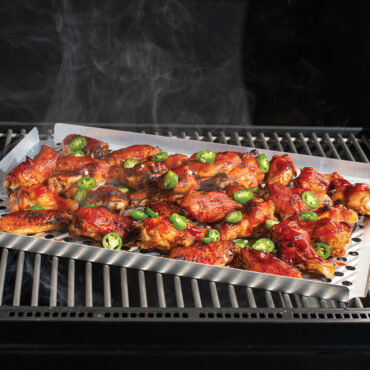 multi purpose rack on grill with chicken wings