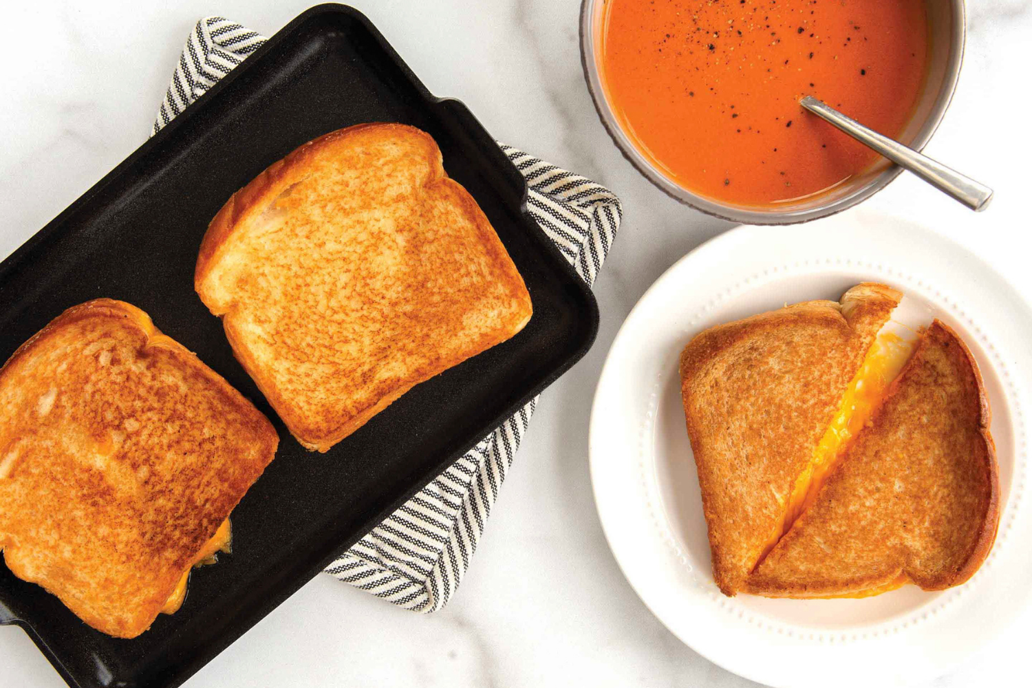 Grilled cheese cooked on the Nordic Ware Mini Griddle served with some tomato soup.