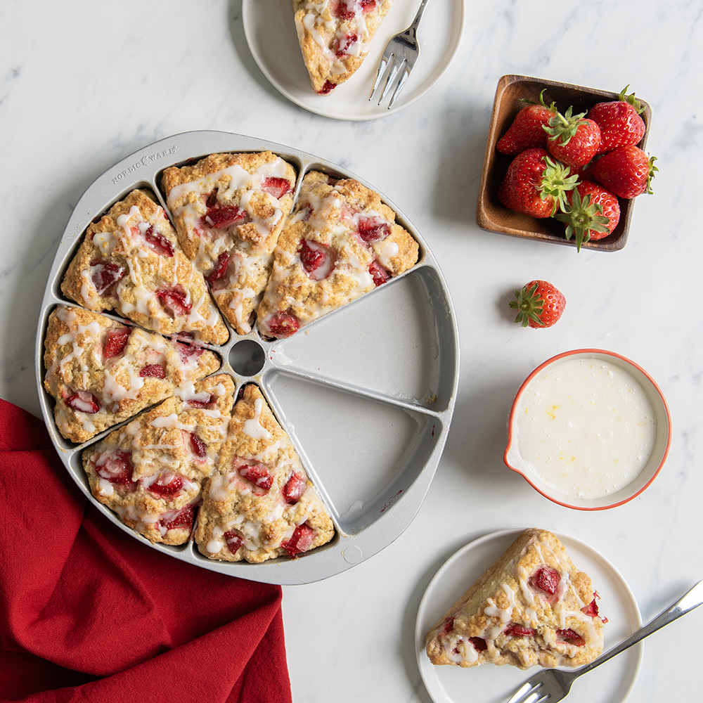 Image of strawberry scones baked in Nordic Ware scone pan, two scones on plate