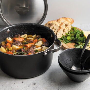nordic ware 6 qt aluminum dutch oven on stovetop with stew