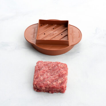 square stuffed burger press part staged with shaped hamburger meat