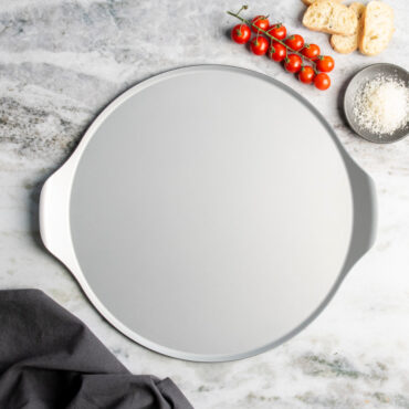 nordic ware aluminized steel pizza & baking steel pan on countertop with ingredients