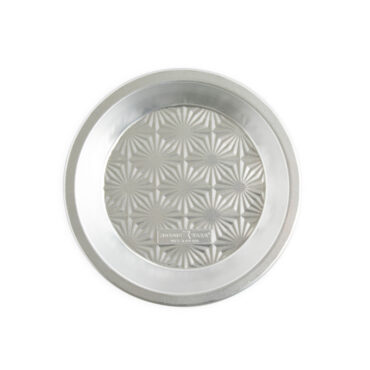 overhead of nordic ware vintage starburst pie pan on white background