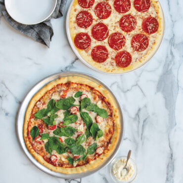 two pizzas on Nordic War perforated Hot Air Crisper Pizza Pans