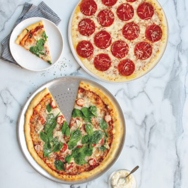 two pizzas on Nordic War perforated Hot Air Crisper Pizza Pans