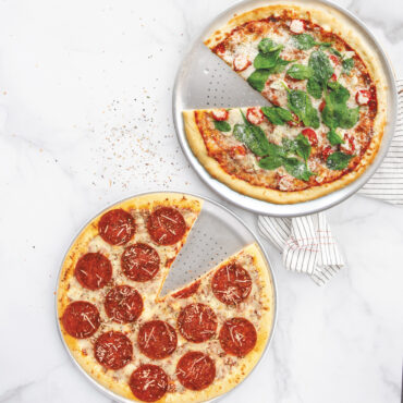 two pizzas on Nordic War perforated Hot Air Crisper Pizza Pans