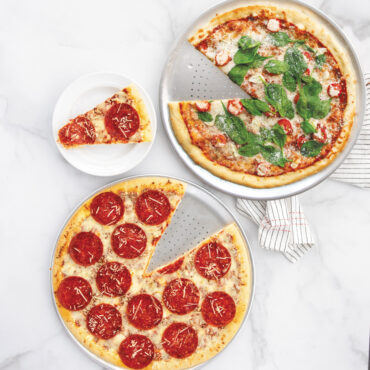two pizzas on Nordic War perforated Hot Air Crisper Pizza Pans