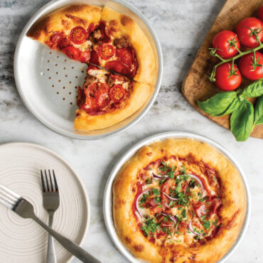 freshly baked pizzas on hot air pizza crisper pans