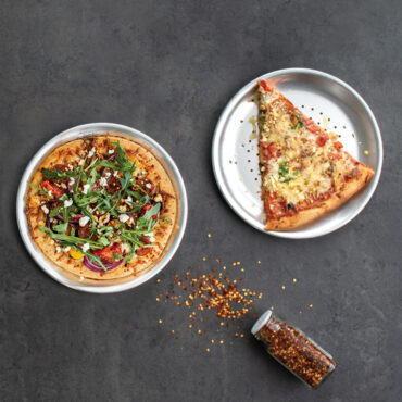 Round aluminum pizza crisper pan with perforated bottom, natural silver finish, showing airflow holes for crispy crusts