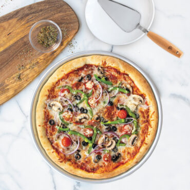 nordic ware 14 inch deep dish pizza pan with supreme pizza and cake server with wooden handle